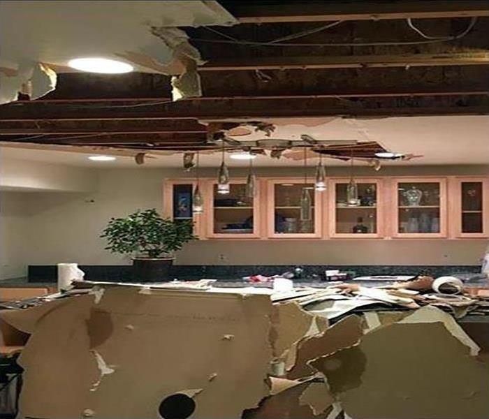 ceiling collapsed from kitchen area, debris on counters of kitchen 