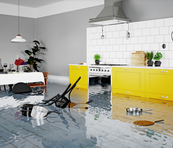 a flooded kitchen with items floating everywhere