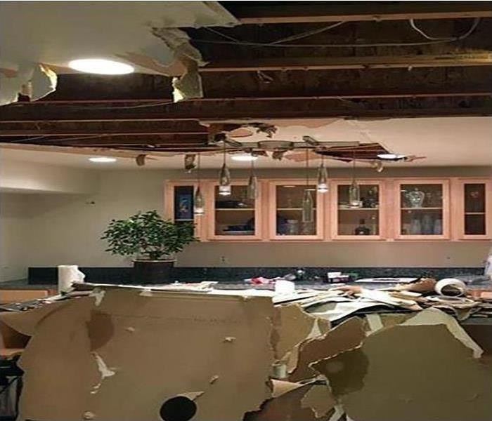 Ceiling collapsed from a house due to water damage
