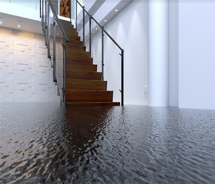 flooded interior of an office building going up to a stairwell