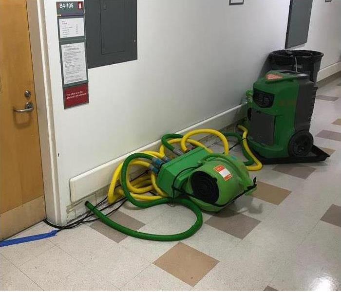  An Injectidry System in a hall way damaged by water damage